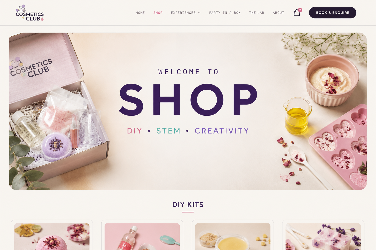 An open Cosmetics Club DIY kit box with bottles, tools, materials and a branded pouch, ready for making at home.